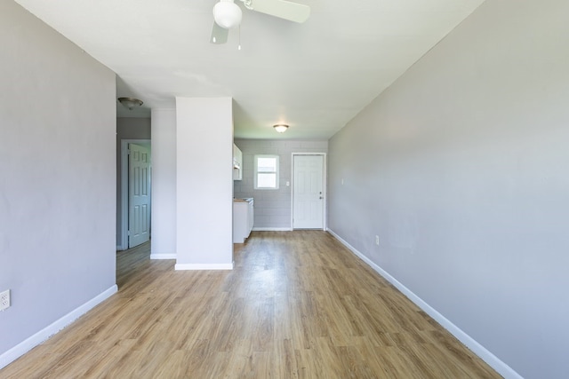 unfurnished living room with light hardwood / wood-style flooring and ceiling fan