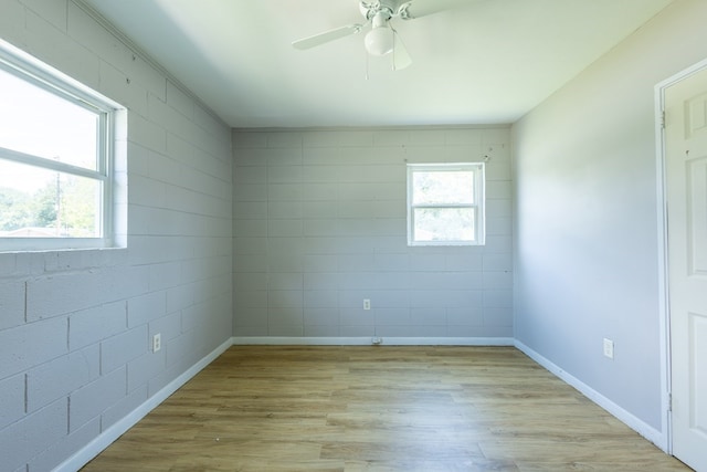 spare room featuring ceiling fan and light hardwood / wood-style flooring