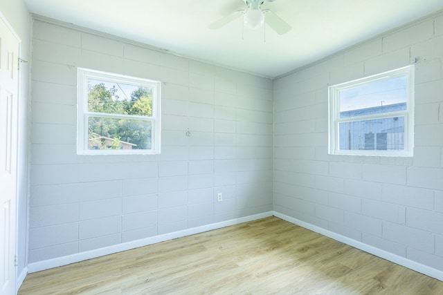 unfurnished room featuring ceiling fan and light hardwood / wood-style flooring