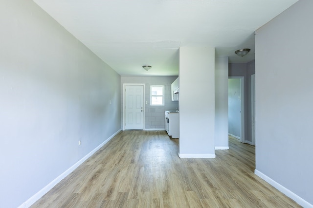 unfurnished living room with light hardwood / wood-style flooring