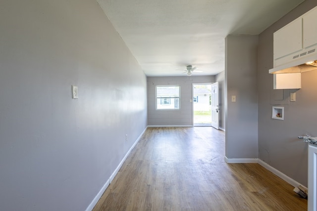 unfurnished room featuring ceiling fan and light hardwood / wood-style flooring