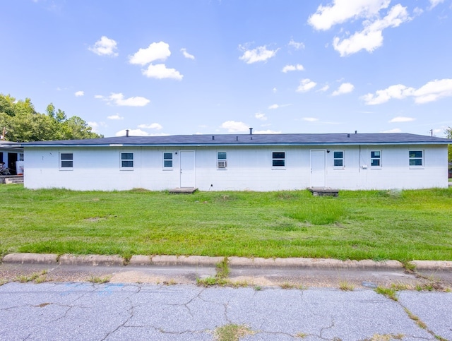 rear view of house with a yard