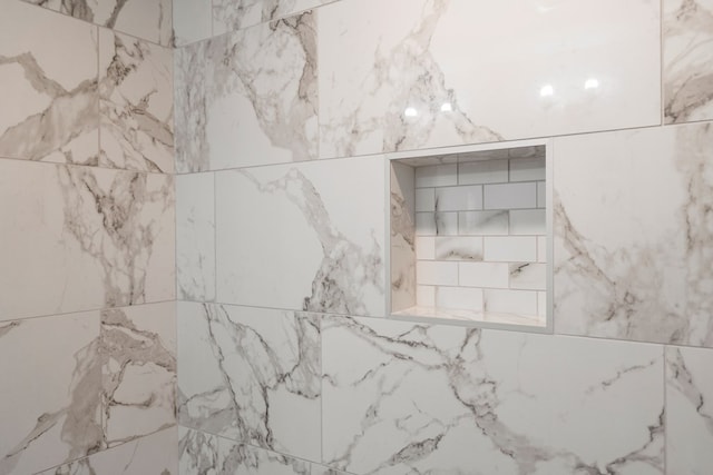 bathroom view of tiled shower
