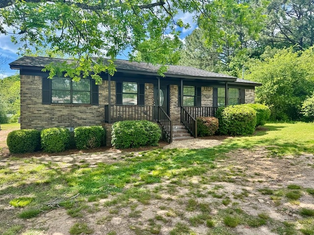 ranch-style home with brick siding and a porch