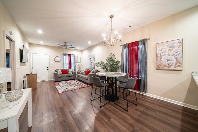 dining room featuring dark wood-type flooring, recessed lighting, visible vents, and baseboards