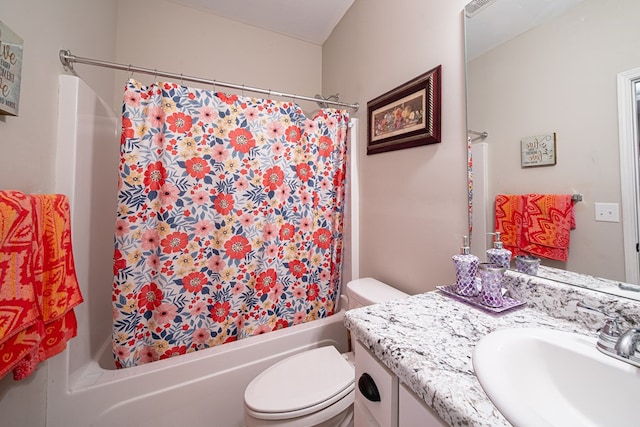 bathroom with shower / bath combination with curtain, vanity, and toilet