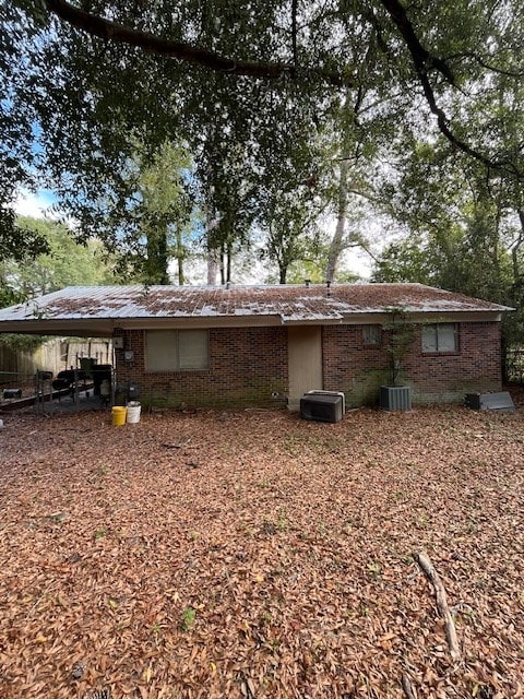 view of side of home featuring central AC unit