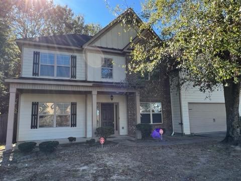 view of front of property featuring a garage