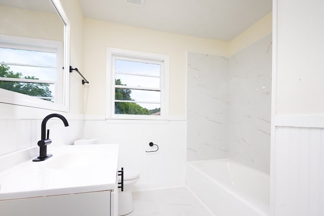 2917 Doyle Ave, Columbus, GA 31907 - full bathroom featuring vanity, a wainscoted wall, marble finish floors, and shower / washtub combination