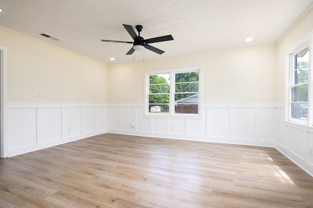 2917 Doyle Ave, Columbus, GA 31907 - spare room with a decorative wall, a wainscoted wall, a ceiling fan, wood finished floors, and recessed lighting