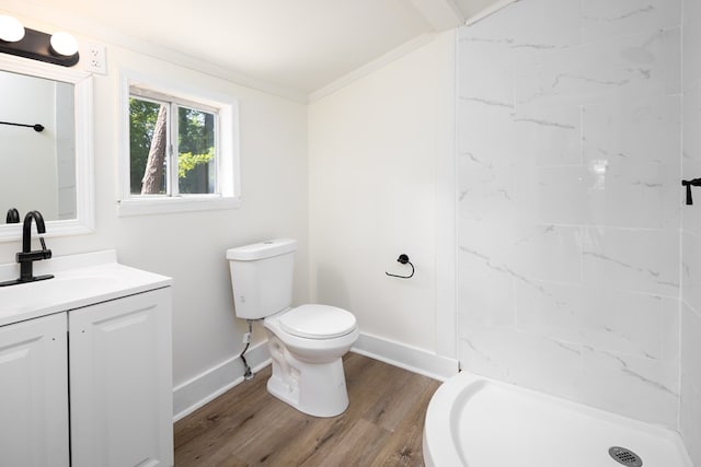 2917 Doyle Ave, Columbus, GA 31907 - bathroom featuring toilet, vanity, baseboards, wood finished floors, and a stall shower