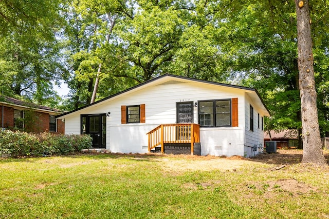 2917 Doyle Ave, Columbus, GA 31907 - view of front of house with cooling unit, a front yard, and brick siding