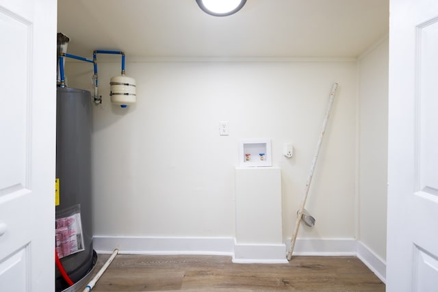 2917 Doyle Ave, Columbus, GA 31907 - laundry area featuring water heater, wood finished floors, hookup for a washing machine, and baseboards