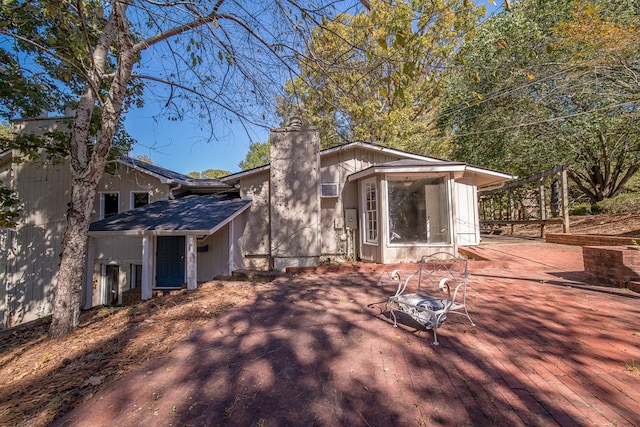 exterior space featuring a sunroom