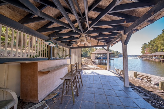 view of patio / terrace with a water view and ceiling fan