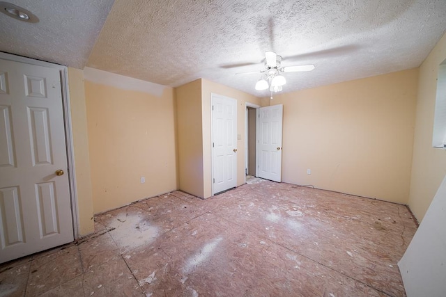 unfurnished bedroom featuring a textured ceiling and ceiling fan