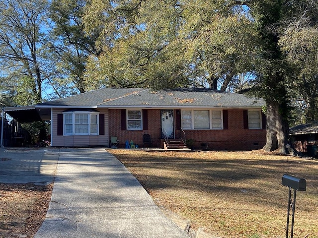 single story home with a carport