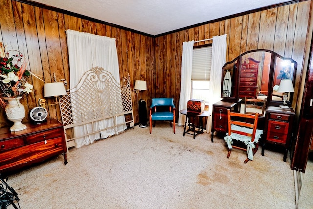 sitting room with light colored carpet, ornamental molding, and wood walls