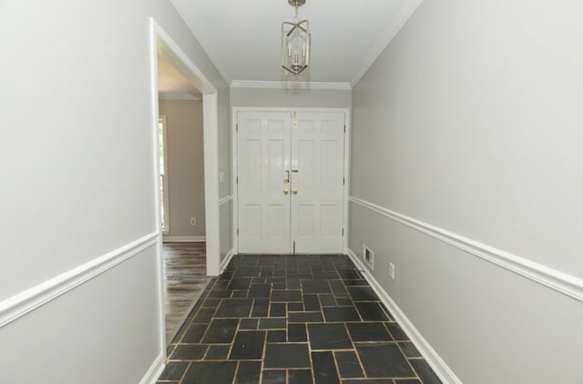 interior space featuring visible vents, baseboards, and ornamental molding