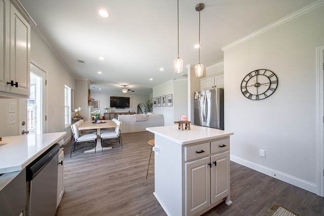 8008 Barton Dr, Midland, GA 31820 - kitchen with stainless steel appliances, crown molding, recessed lighting, open floor plan, and dark wood-style floors