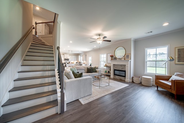 8008 Barton Dr, Midland, GA 31820 - living area with a ceiling fan, healthy amount of natural light, crown molding, a stone fireplace, and stairs