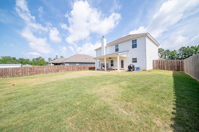 8008 Barton Dr, Midland, GA 31820 - back of house featuring ceiling fan, a patio, a fenced backyard, and a chimney
