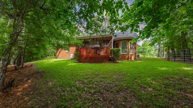 back of house featuring a wooden deck and brick siding