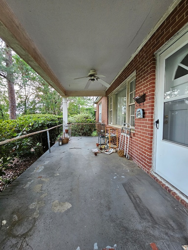 view of patio featuring ceiling fan and a porch