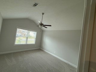 7300 Pine Chase Dr, Midland, GA 31820 - spare room featuring vaulted ceiling, ceiling fan, and carpet