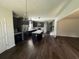 7300 Pine Chase Dr, Midland, GA 31820 - kitchen with appliances with stainless steel finishes, dark wood finished floors, a center island, and open floor plan