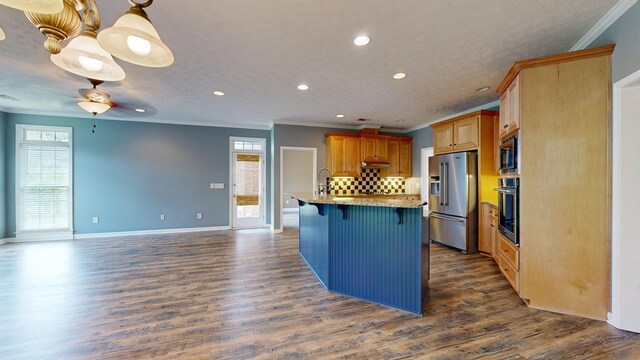 4756 Timarron Loop, Columbus, GA 31909 - kitchen with stainless steel appliances, ornamental molding, recessed lighting, a kitchen bar, and healthy amount of natural light