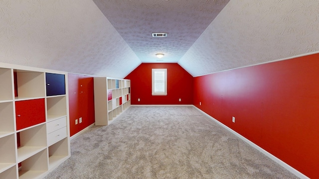4756 Timarron Loop, Columbus, GA 31909 - bonus room featuring a textured ceiling, lofted ceiling, and carpet