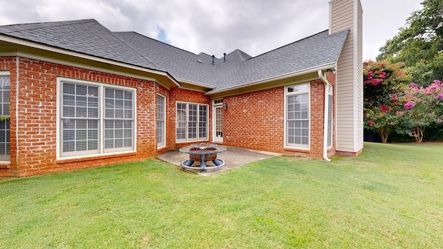 4756 Timarron Loop, Columbus, GA 31909 - rear view of property with a patio, a lawn, a chimney, and brick siding
