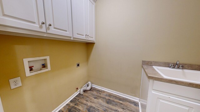 4756 Timarron Loop, Columbus, GA 31909 - laundry area with cabinet space, electric dryer hookup, hookup for a washing machine, and wood finished floors