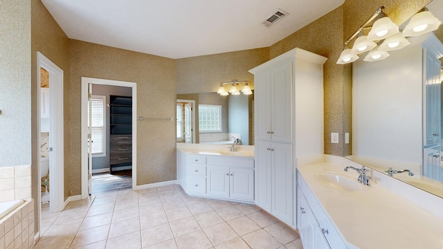 4756 Timarron Loop, Columbus, GA 31909 - bathroom featuring a chandelier, tile patterned floors, two vanities, and tiled tub