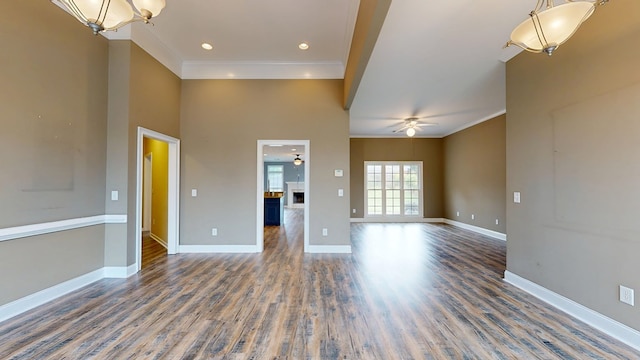 4756 Timarron Loop, Columbus, GA 31909 - unfurnished living room featuring ornamental molding, wood finished floors, ceiling fan, a fireplace, and a chandelier