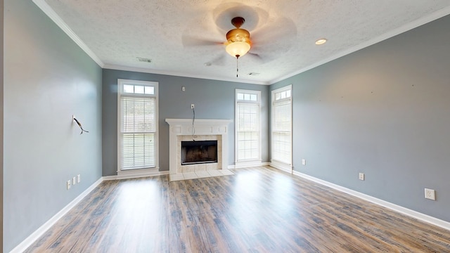 4756 Timarron Loop, Columbus, GA 31909 - unfurnished living room featuring ceiling fan, a textured ceiling, a fireplace, wood finished floors, and ornamental molding