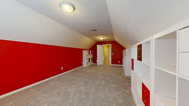 4756 Timarron Loop, Columbus, GA 31909 - additional living space featuring carpet floors, lofted ceiling, and a textured ceiling