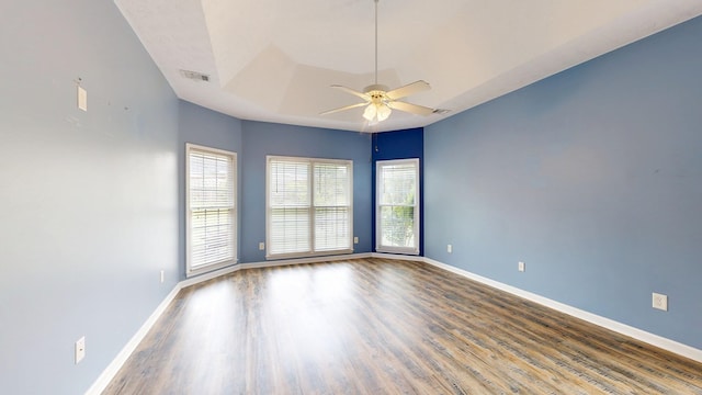 4756 Timarron Loop, Columbus, GA 31909 - unfurnished room with ceiling fan, wood finished floors, and a tray ceiling