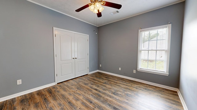 4756 Timarron Loop, Columbus, GA 31909 - unfurnished bedroom featuring dark wood-style floors, ornamental molding, a closet, and a ceiling fan