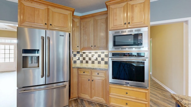 4756 Timarron Loop, Columbus, GA 31909 - kitchen with appliances with stainless steel finishes, light stone countertops, wood finished floors, tasteful backsplash, and ornamental molding