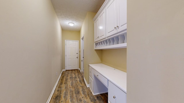 4756 Timarron Loop, Columbus, GA 31909 - laundry room with a textured ceiling and dark wood-style floors