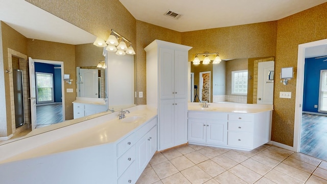 4756 Timarron Loop, Columbus, GA 31909 - full bathroom featuring two vanities, tile patterned floors, and a chandelier