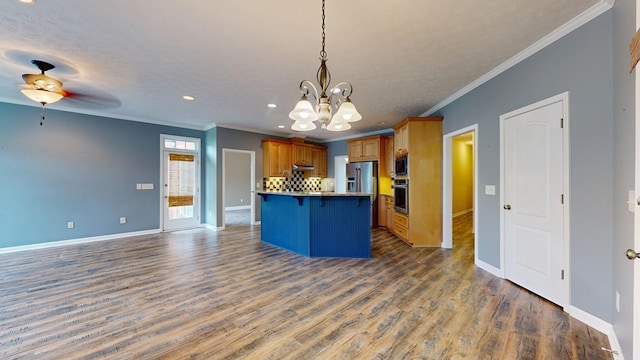 4756 Timarron Loop, Columbus, GA 31909 - kitchen with stainless steel appliances, crown molding, a chandelier, a breakfast bar area, and a ceiling fan