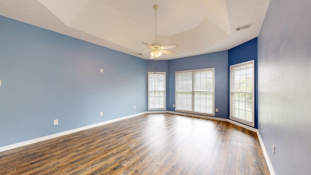 4756 Timarron Loop, Columbus, GA 31909 - empty room with ceiling fan, wood finished floors, and a tray ceiling