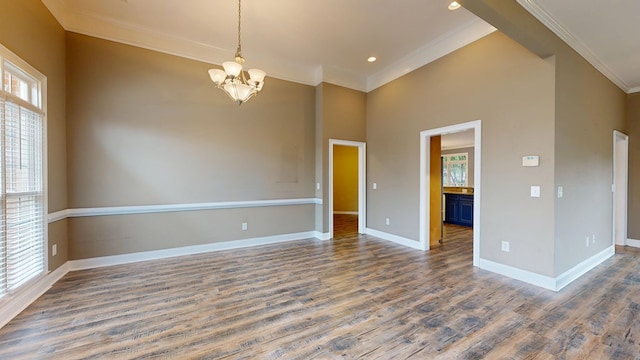 4756 Timarron Loop, Columbus, GA 31909 - spare room featuring healthy amount of natural light, ornamental molding, wood finished floors, a chandelier, and a high ceiling