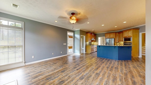 4756 Timarron Loop, Columbus, GA 31909 - kitchen featuring stainless steel appliances, ornamental molding, open floor plan, a ceiling fan, and recessed lighting