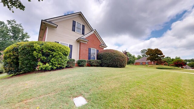 4756 Timarron Loop, Columbus, GA 31909 - view of property exterior with brick siding and a yard