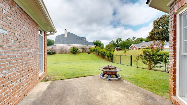 4756 Timarron Loop, Columbus, GA 31909 - fenced backyard with a patio area and an outdoor fire pit