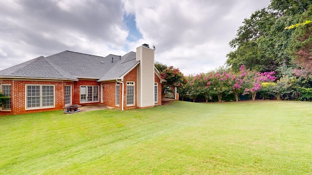 4756 Timarron Loop, Columbus, GA 31909 - back of property with a chimney, a lawn, and brick siding
